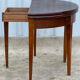 Table demi-lune en placage d'acajou