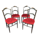 Set of four Napoleon III chairs in black lacquered wood with gold highlights.