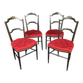 Série de quatre chaises Napoléon III en bois laqué noir et rechampi or