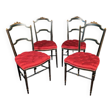 Série de quatre chaises Napoléon III en bois laqué noir et rechampi or