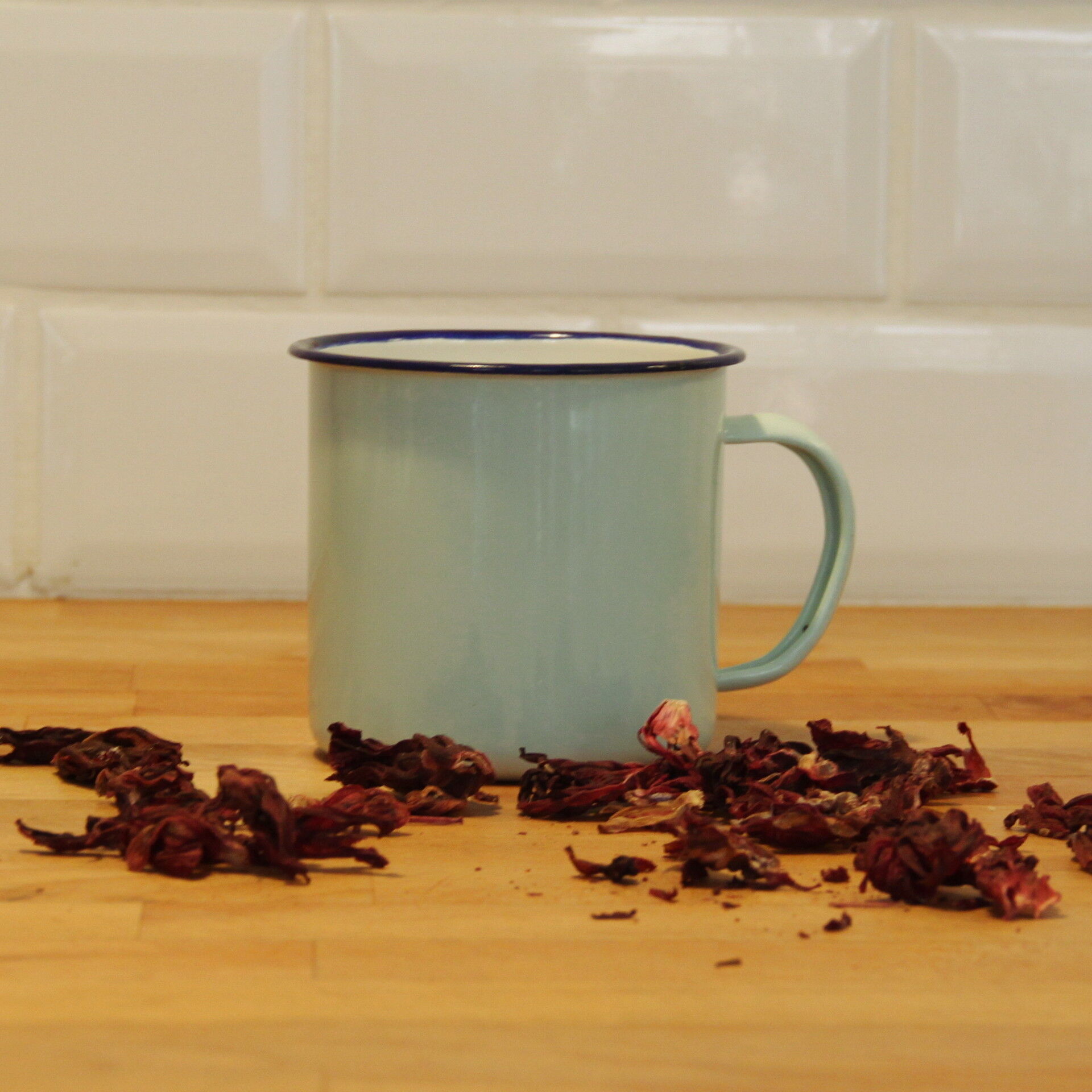 Green enamelled mug of water