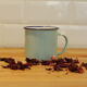 Green enamelled mug of water