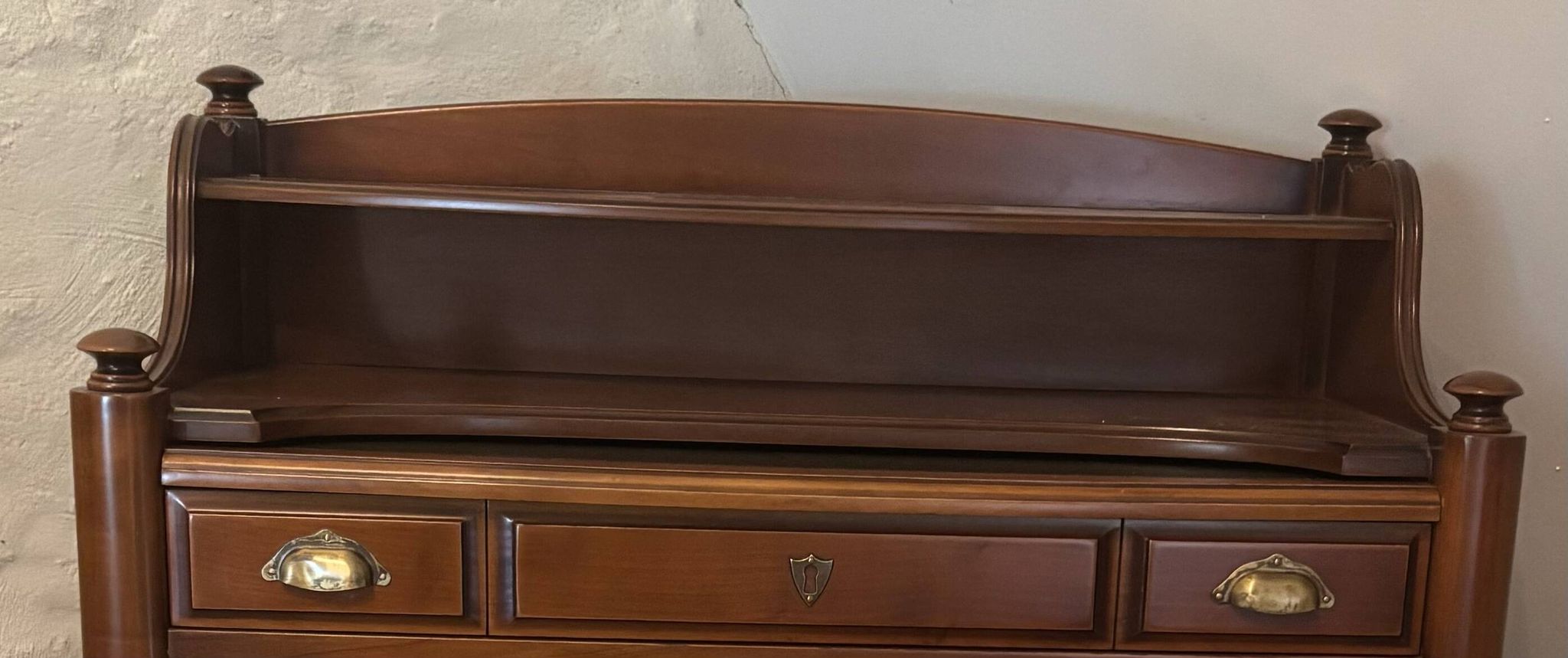 Vintage drop-leaf secretary with a green leather top and inlays.
