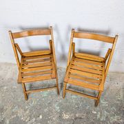 Pair of wooden folding chairs