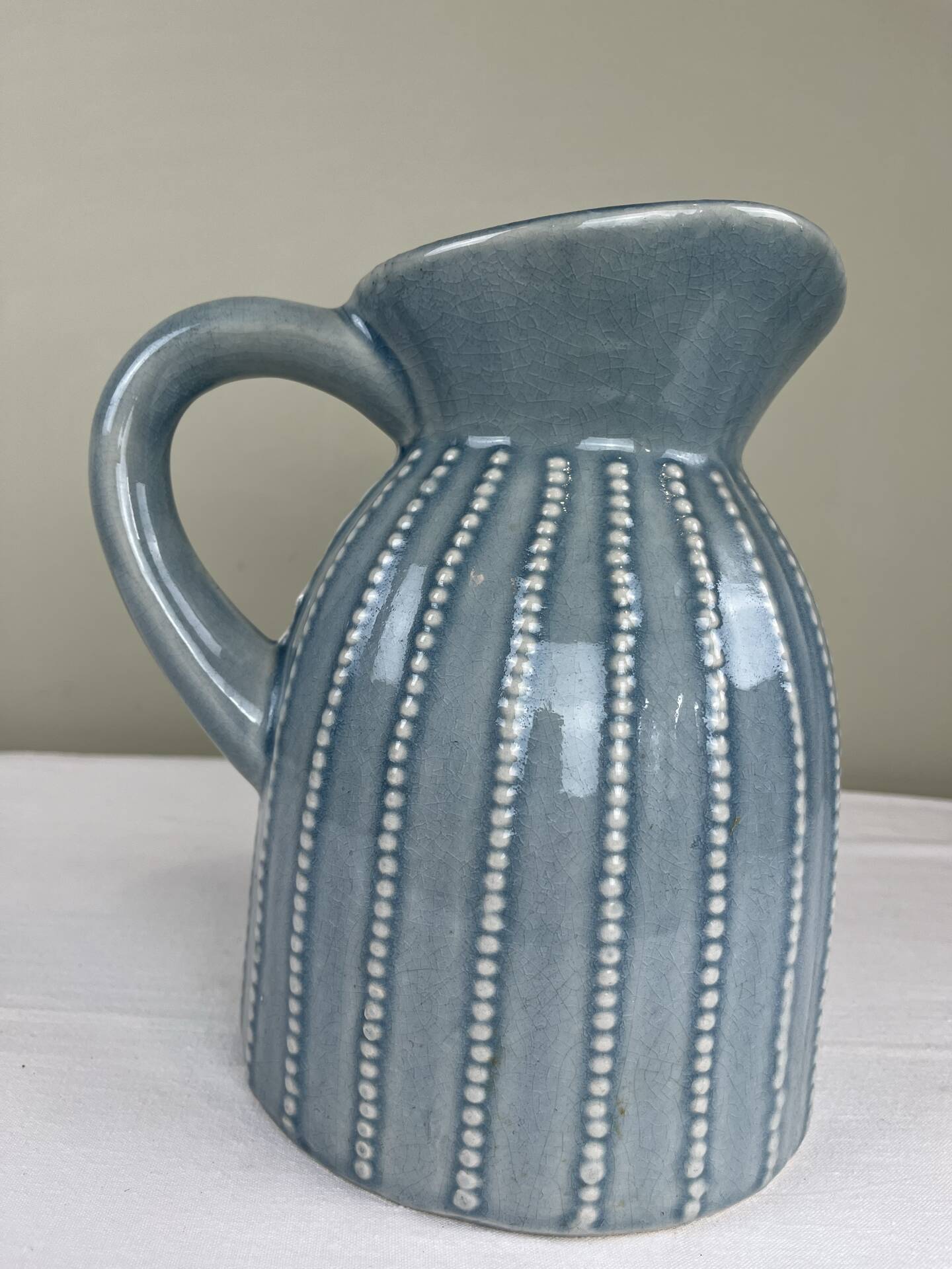 Large vintage pitcher in crackled celadon ceramic, beaded decoration.