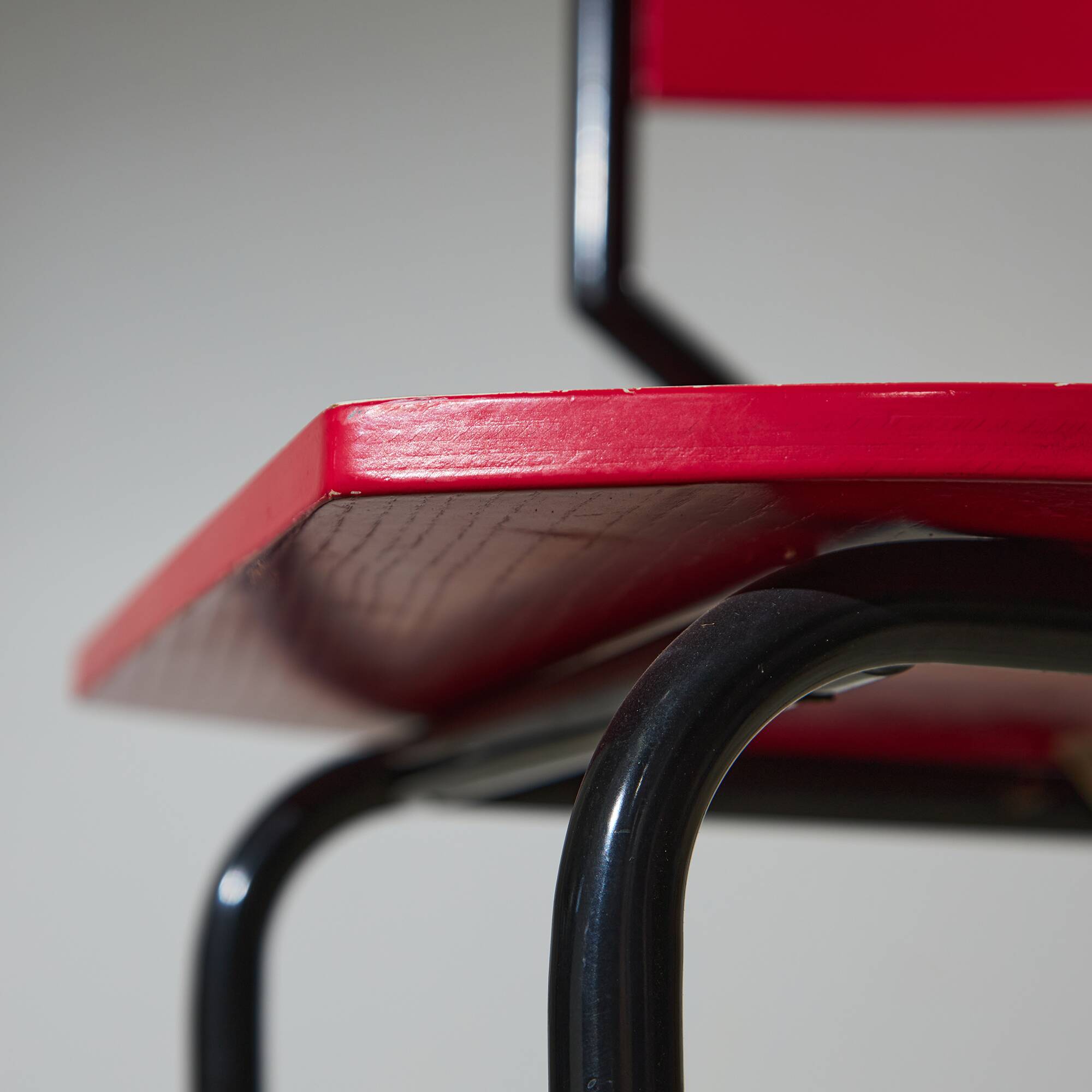 Red Plywood and Curved Metal Frame Chair