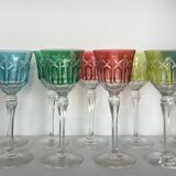 Set of twelve glasses in crystal tinted in different colours and cut with stars.