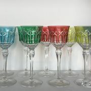Set of twelve glasses in crystal tinted in different colours and cut with stars.