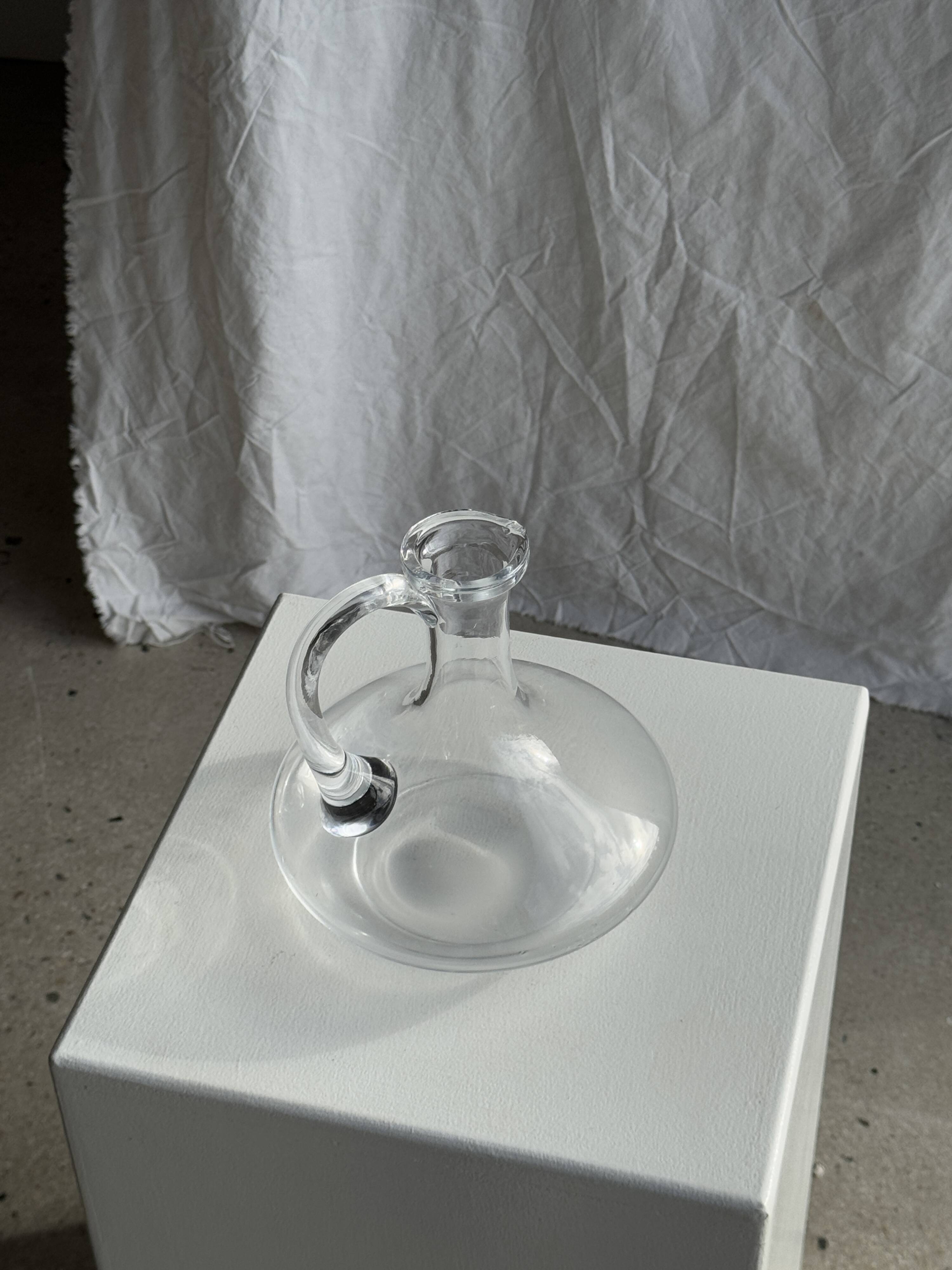 Vintage glass carafe with flattened flared belly handle H18