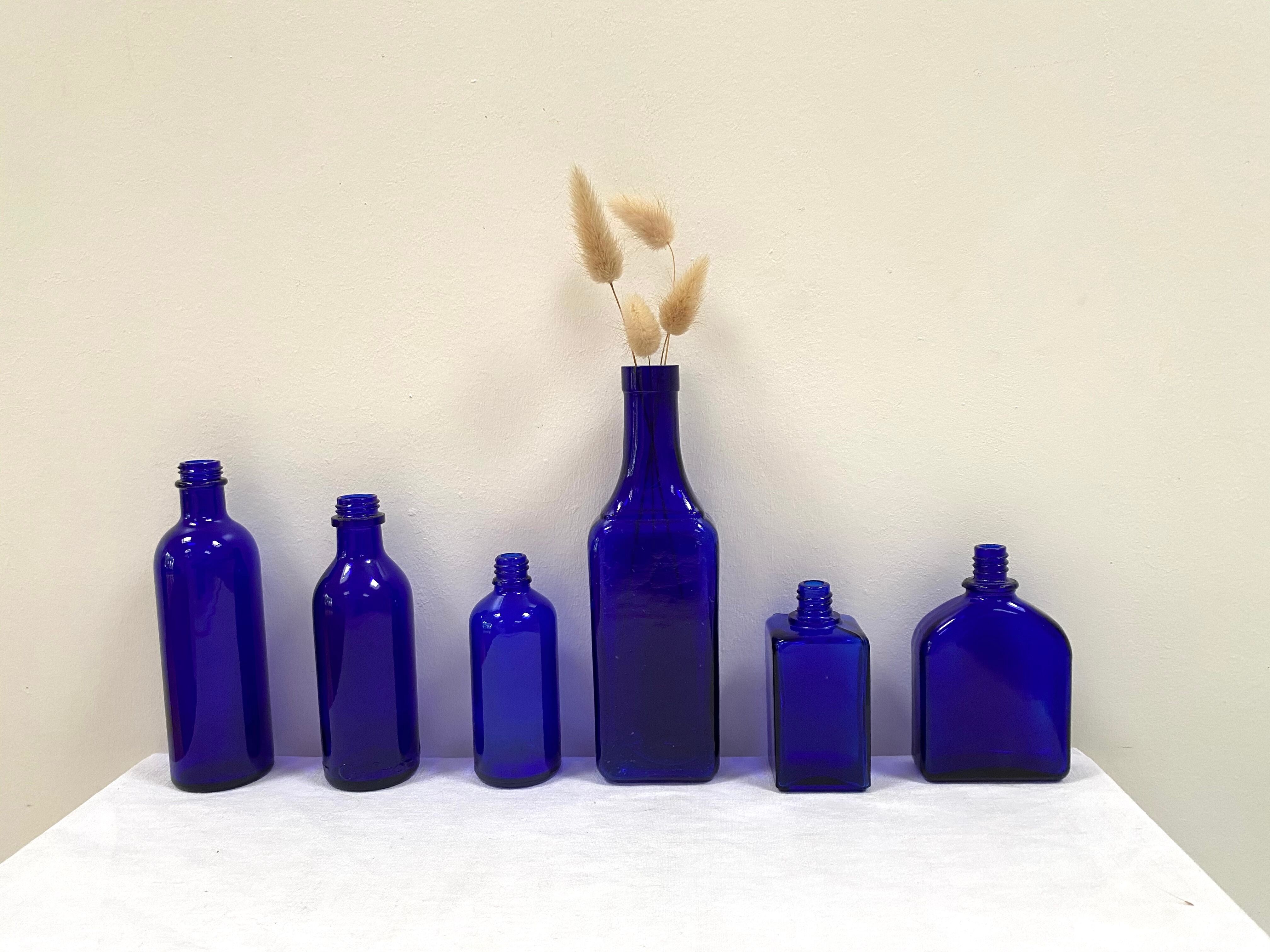 Set of 6 cobalt blue glass pharmacy bottles