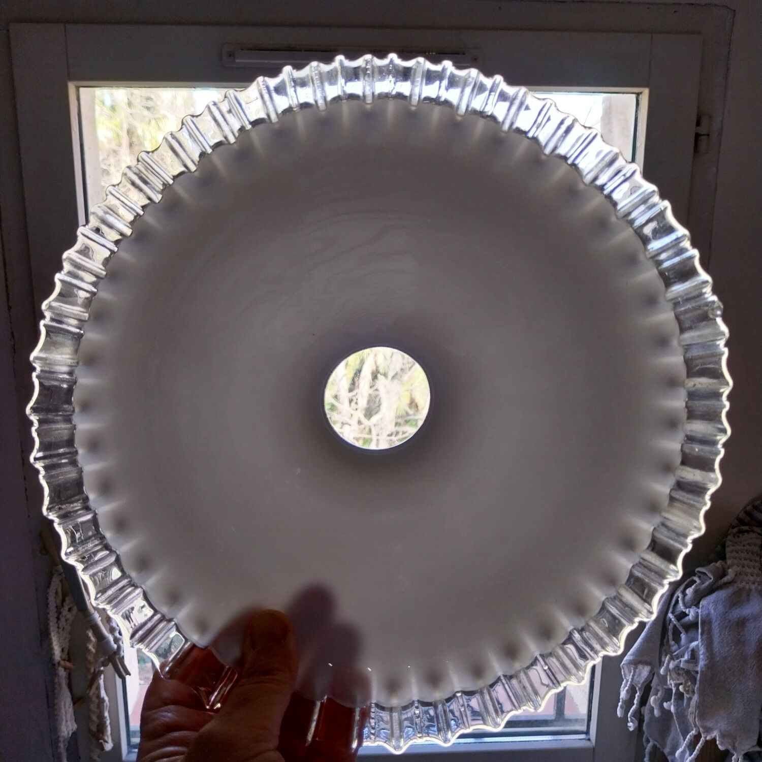 Old lace-edged conical lampshade in opaline