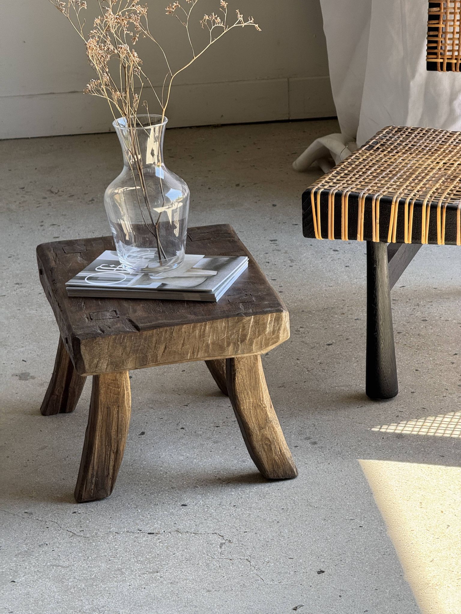 Small stool, rectangular solid teak side table with curved legs.