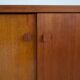 Modern mid-century teak sideboard with brass details.