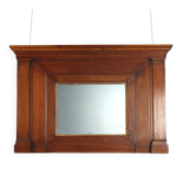 Antique Empire fireplace mirror in walnut with glass decorations, 19th century.