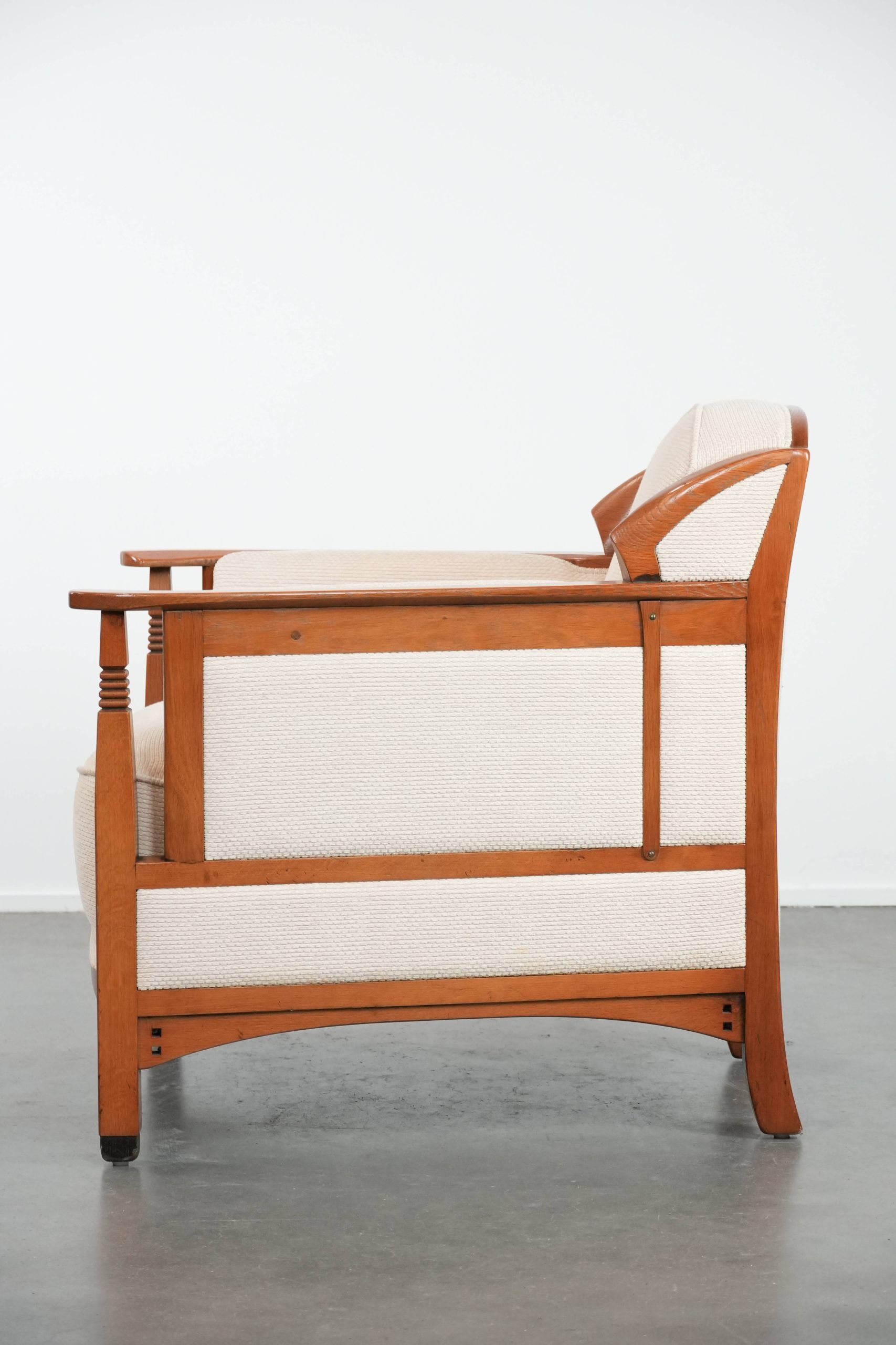 Art Nouveau design armchair with a luxurious light fabric upholstery