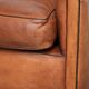 Sheepskin 2-seater sofa with a warm cognac brown colour scheme