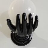 Paire d’appliques mains noires tenant un globe en opaline, années 70