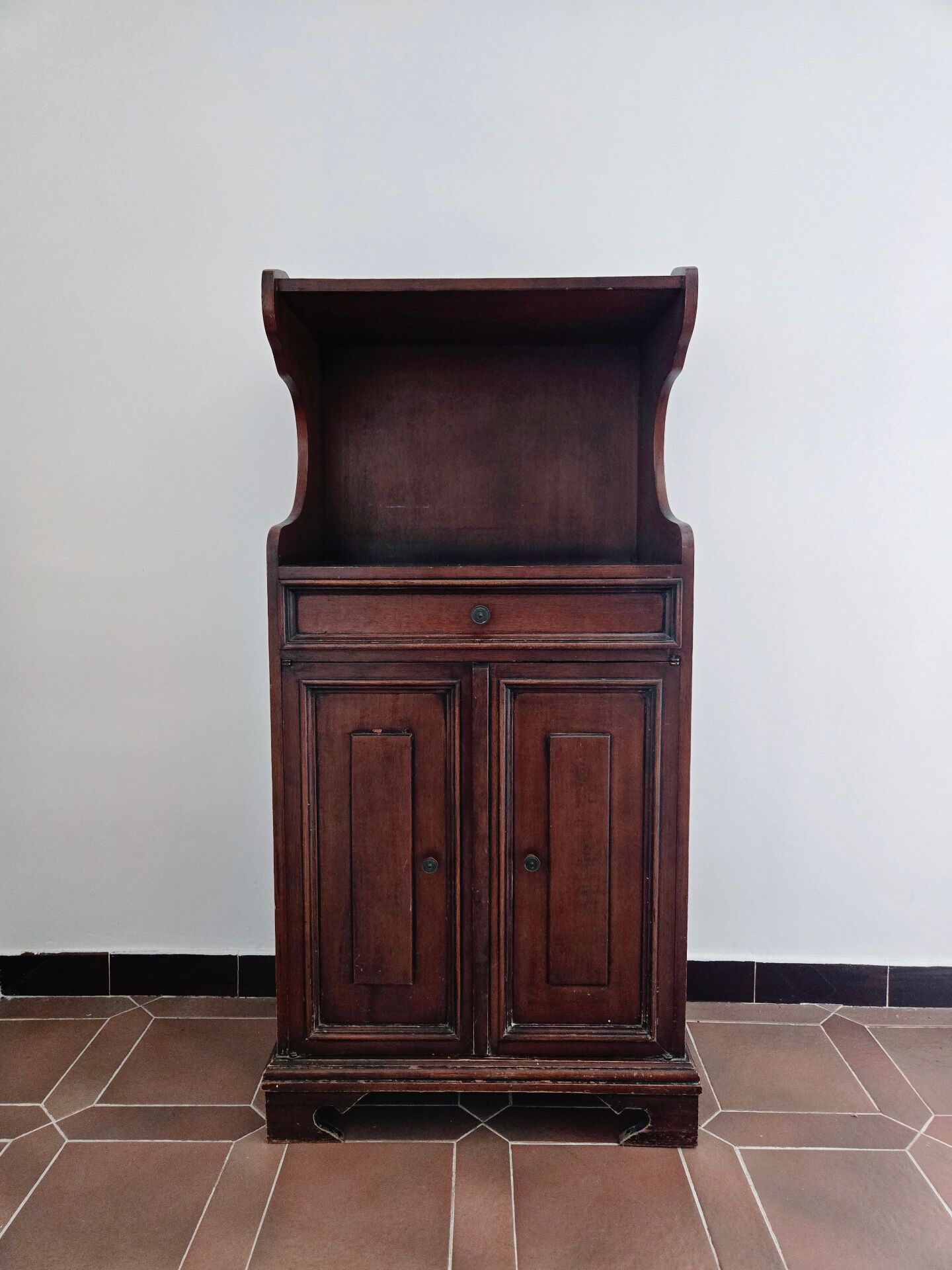 Small antique accent table made of solid wood.