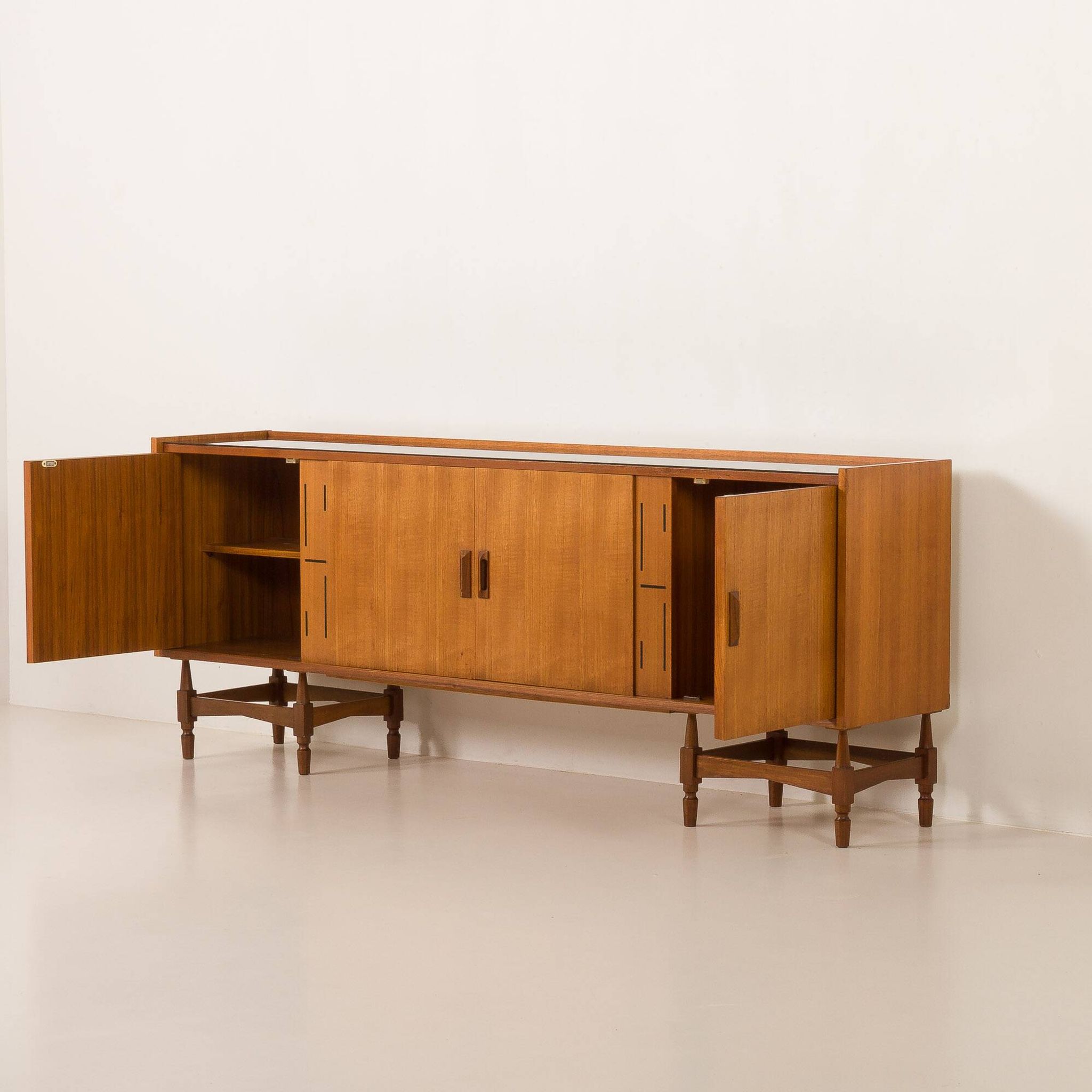 Itaian mid century teak sideboard with black glass top and inlays, 1970s
