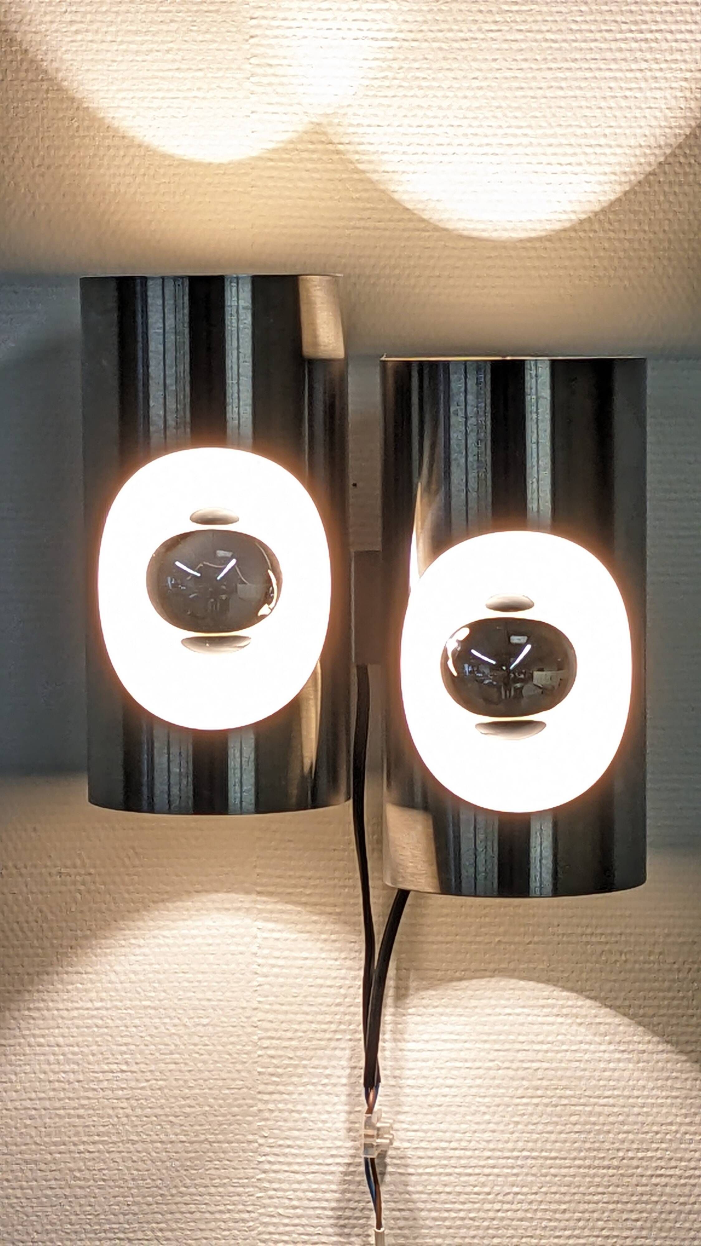 Pair of Space Age double pipe wall lights by Oxar France, 1960s-70s