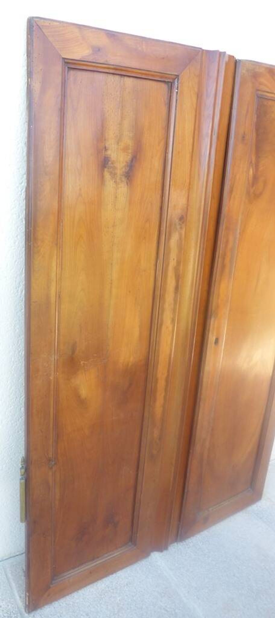 Pair of antique cherry wood cabinet doors from the 19th century in their original part