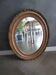 Antique mirror in wood and gilded stucco