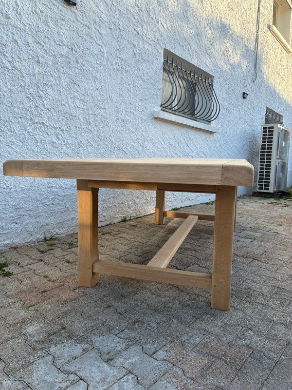 Solid oak farmhouse table with extensions.
