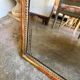 Wooden mirror with gilded stucco and beaded frieze, 45 x 37 cm