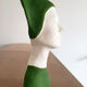 Bust of a woman in green and white plaster