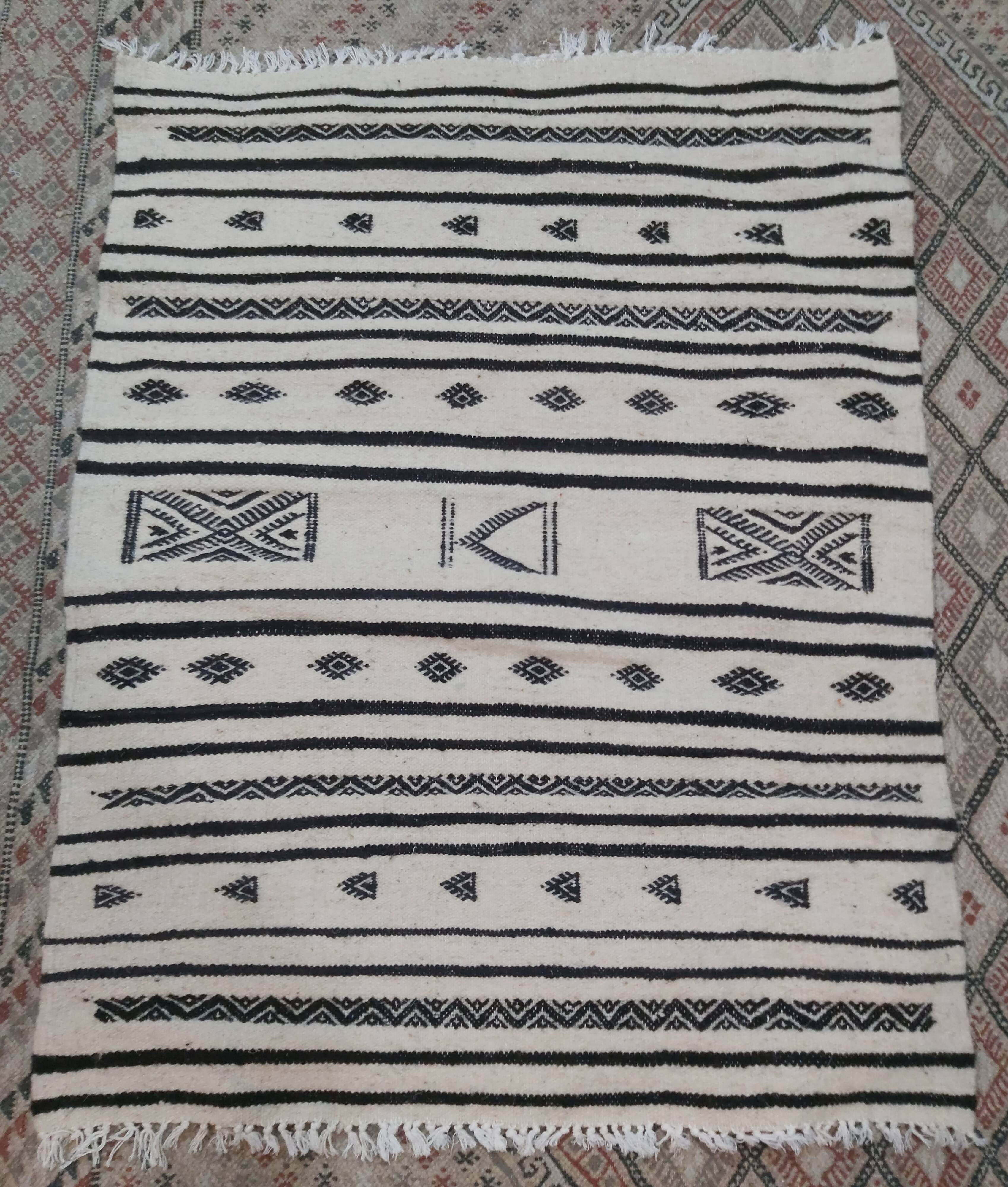 Traditional handmade white and black kilim carpet