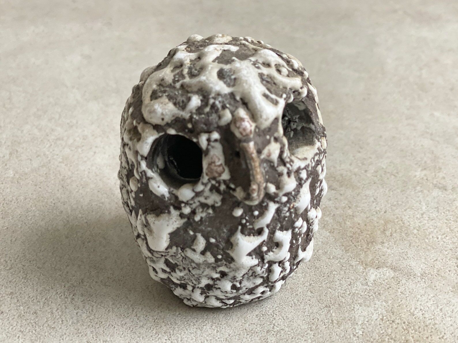 Composition of a small vintage ceramic vase and a ceramic owl figurine / statue