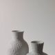 Pair of vintage biscuit porcelain vases by Metzler Ortloff.