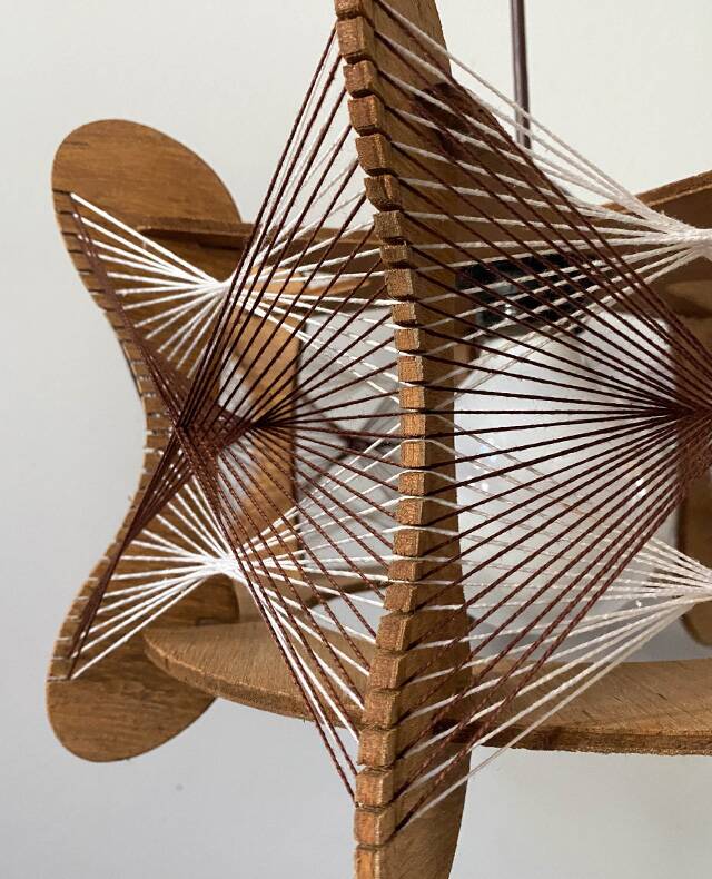 Hanging wood and stretched wire