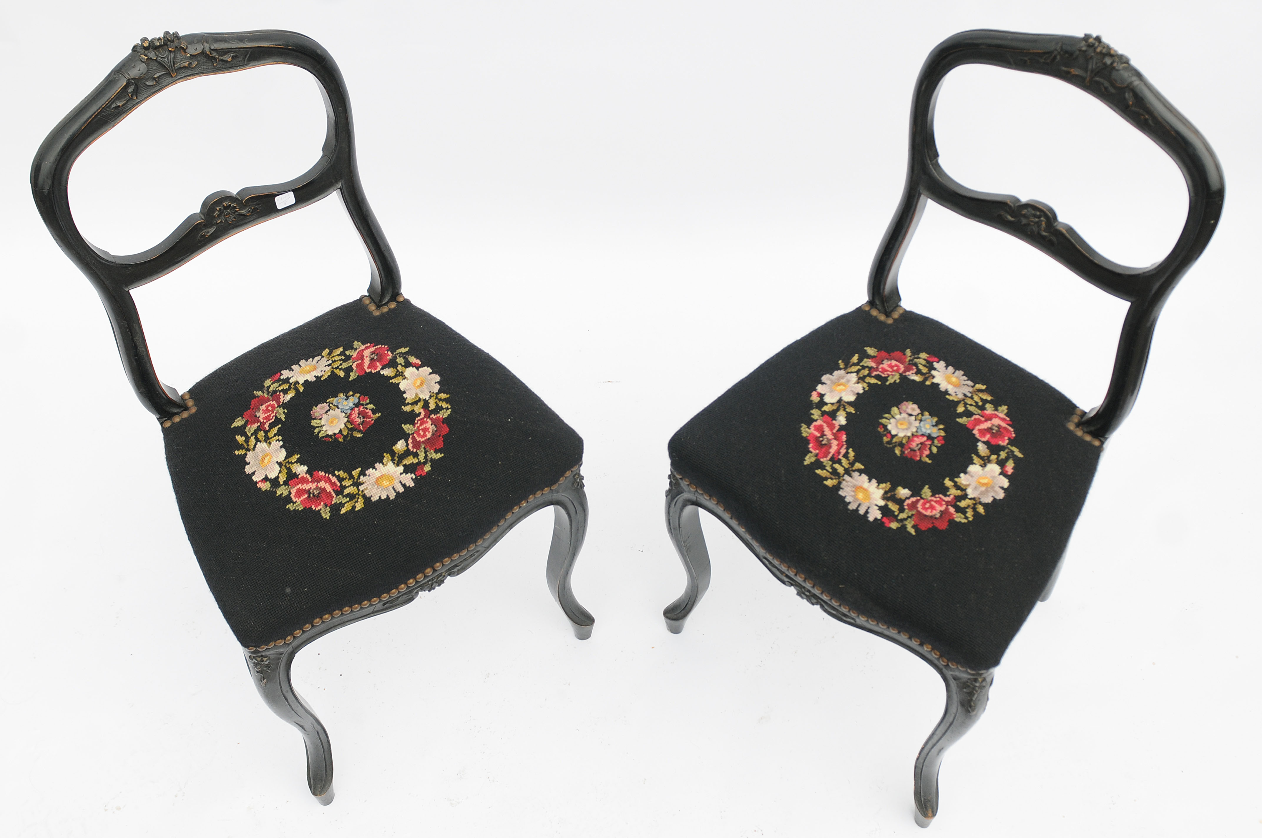Pair of black Louis XV-style chairs