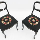 Pair of black Louis XV-style chairs