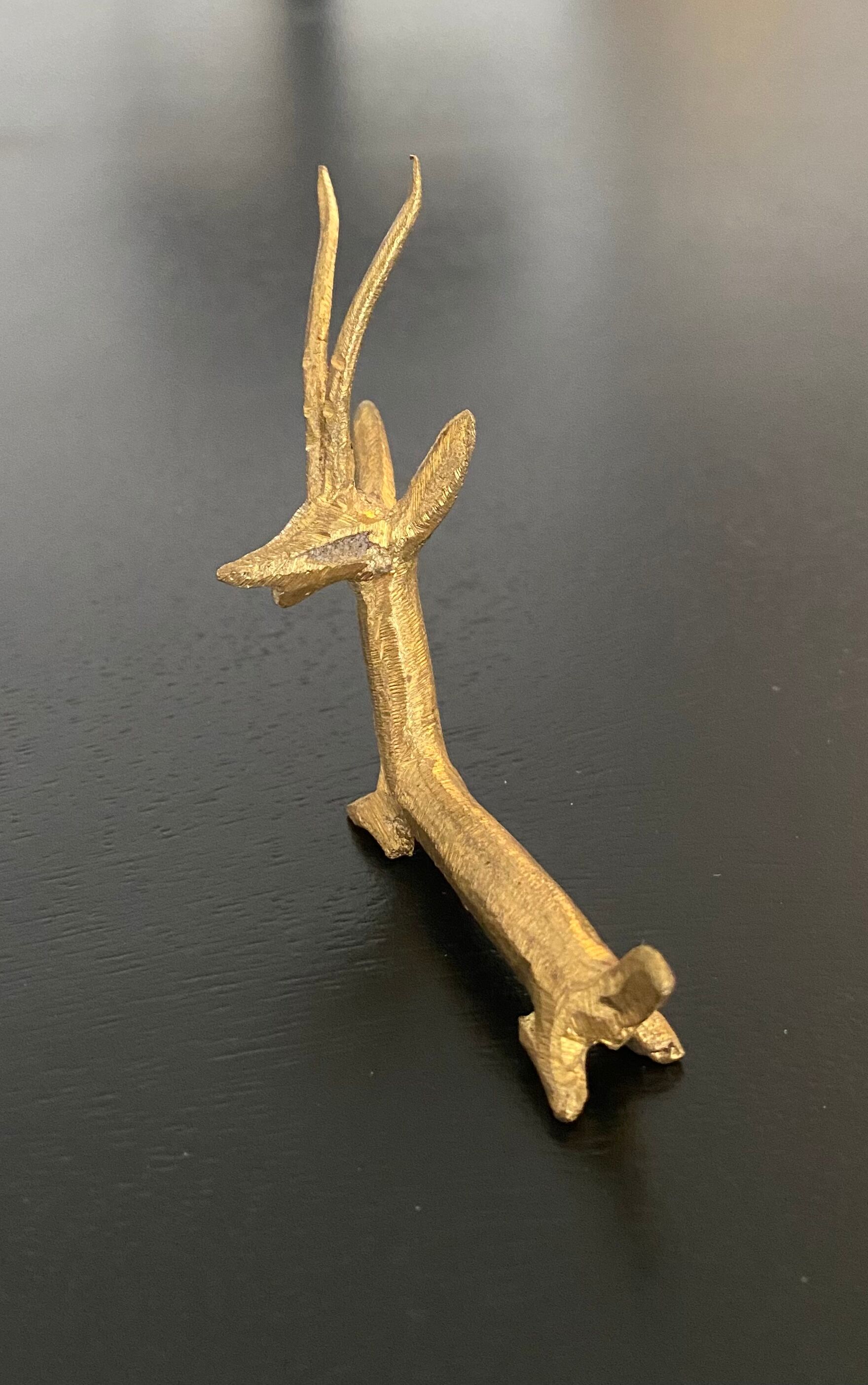 8 porte-couteaux forme antilope et crocodile en laiton