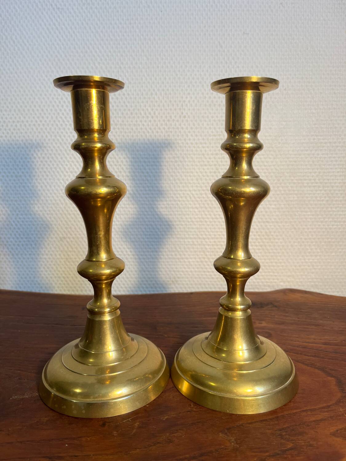 Pair of duo of ringed brass candlesticks