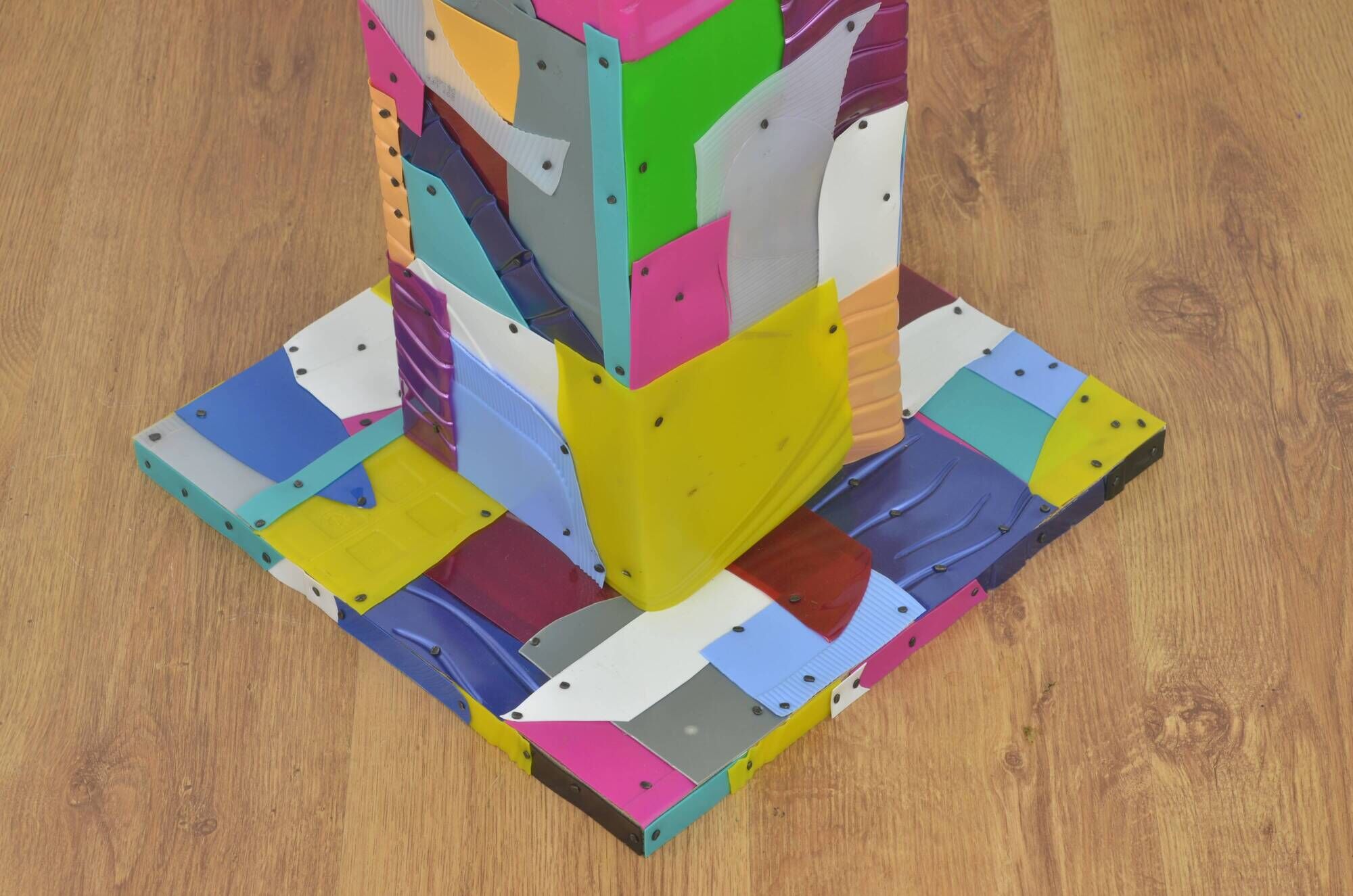 Handmade table made from recycled materials, colourful, abstract.