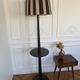 Vintage floor lamp in black patinated wood and striped lampshade