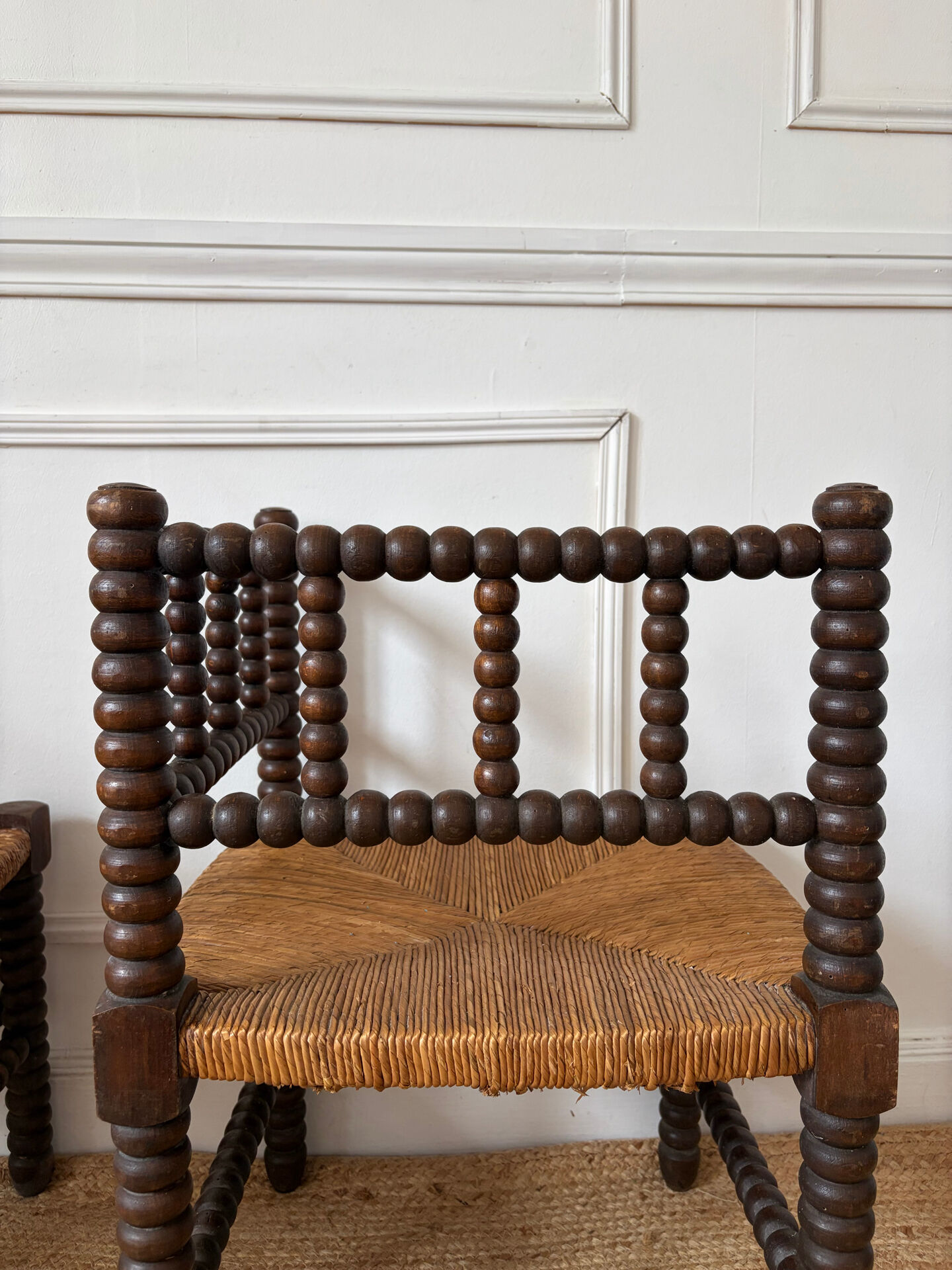 Pair of rush-seated chairs by the fireside "bobbin"