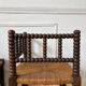 Pair of rush-seated chairs by the fireside "bobbin"