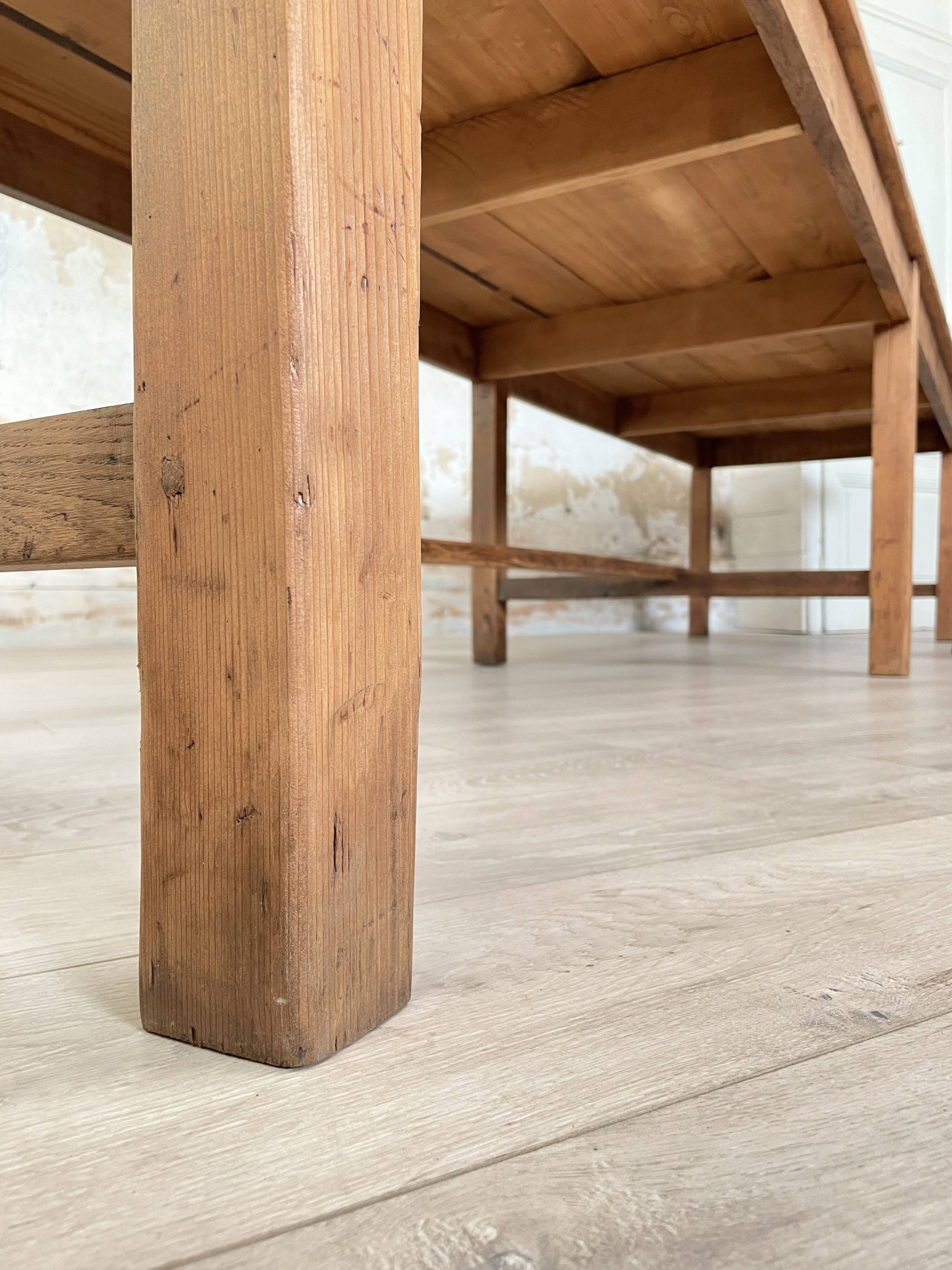 Solid wood workshop table with straight legs.