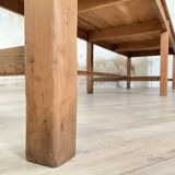 Solid wood workshop table with straight legs.