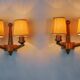 Pair of two-armed art deco "ball" wall lights, carved wood, France, 1960