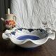 Small hand-painted earthenware salad bowl with garland of blue flowers, mark below