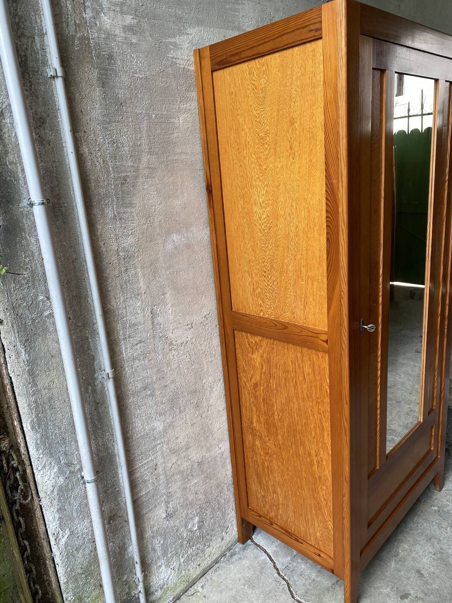 Vintage Parisian wardrobe with one mirrored door from the 60s in pine and wood