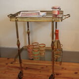 Serving golden skateboard in brass and glass