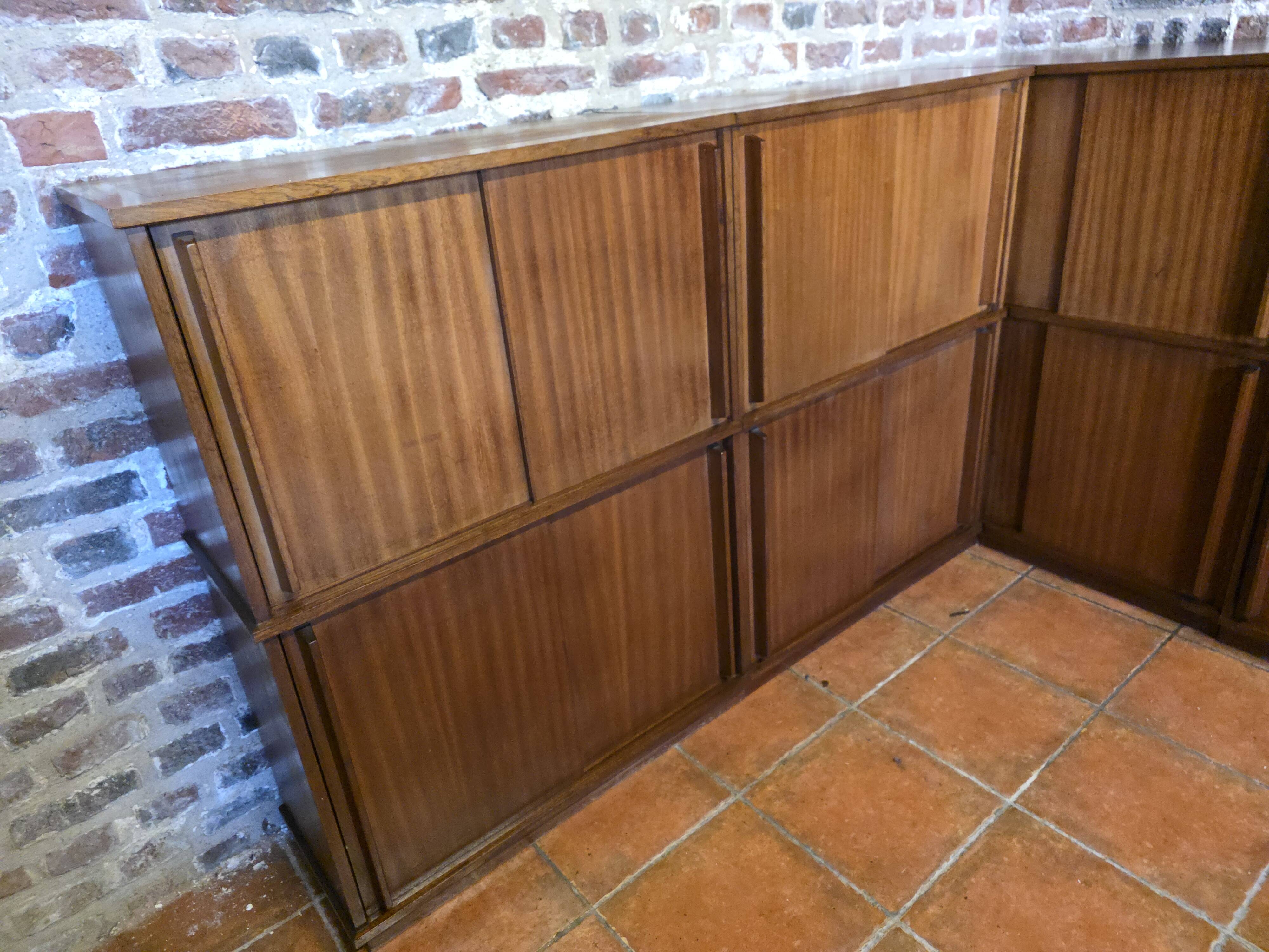 Modular corner library Oscar from the 1960s with sliding doors.