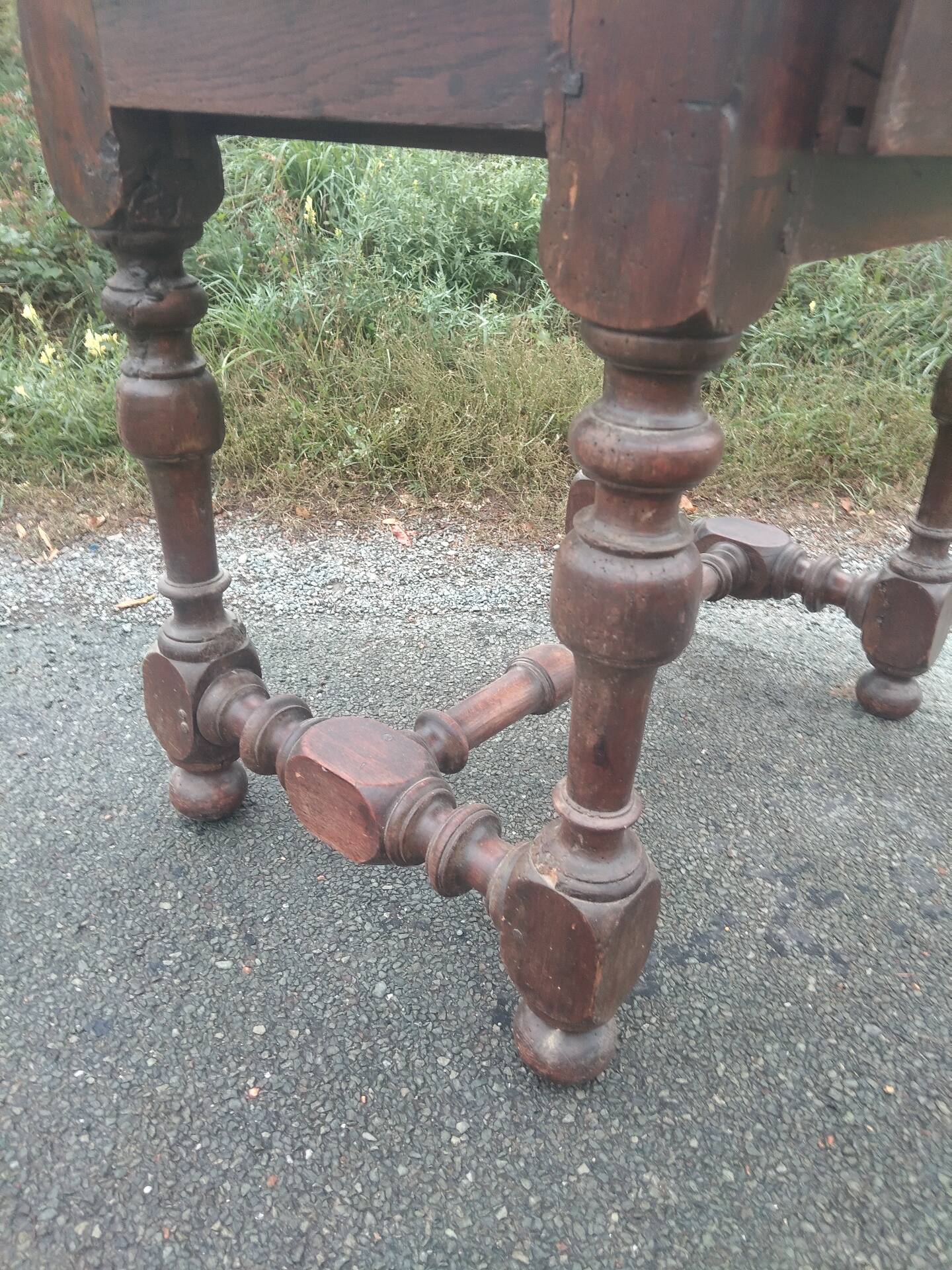 Small antique writing table in Louis XIII style made of oak.