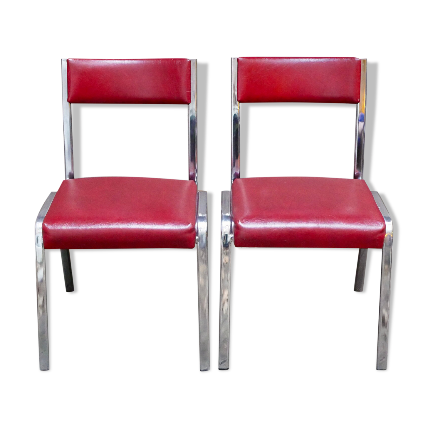 Pair of red leatherette chairs
